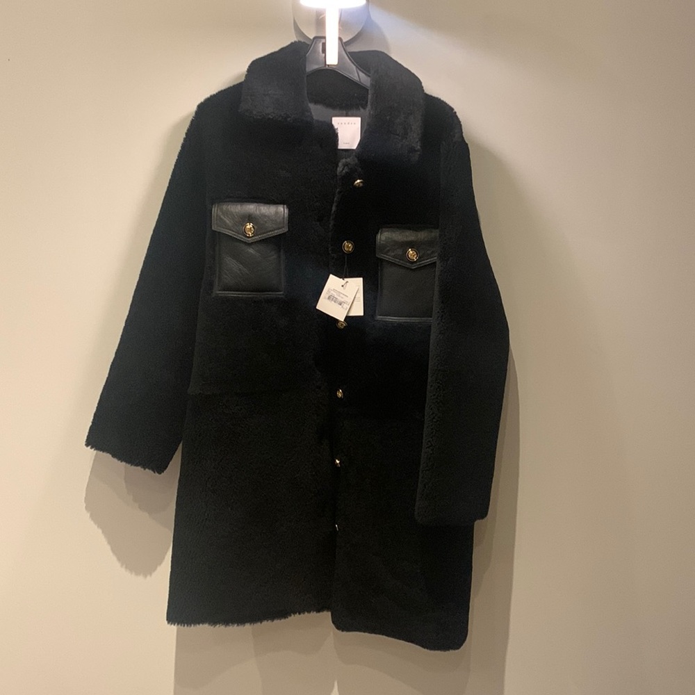 Brand new with tags. Sandro size 4 real shearling coat.